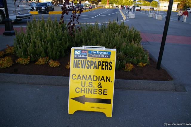 Newspaper sign at the Victoria cruise harbor.jpg