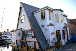 Aphloathaus white floating home at the Fisherman's Wharf in Victoria Canada.jpg