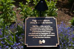 Eagle with Salmon Orca Bear with Salmon plaque at the Butchart Gardens.jpg