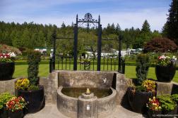 Fountain near rose garden at the Butchart Gardens.jpg