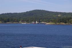 Pier and houses in the Swartz Bay as viewed from ferry to Victoria.jpg
