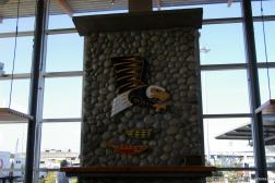 Eagle and fish carvings on the fireplace in the cafe of the BC Ferries Tsawwassen Terminal.jpg